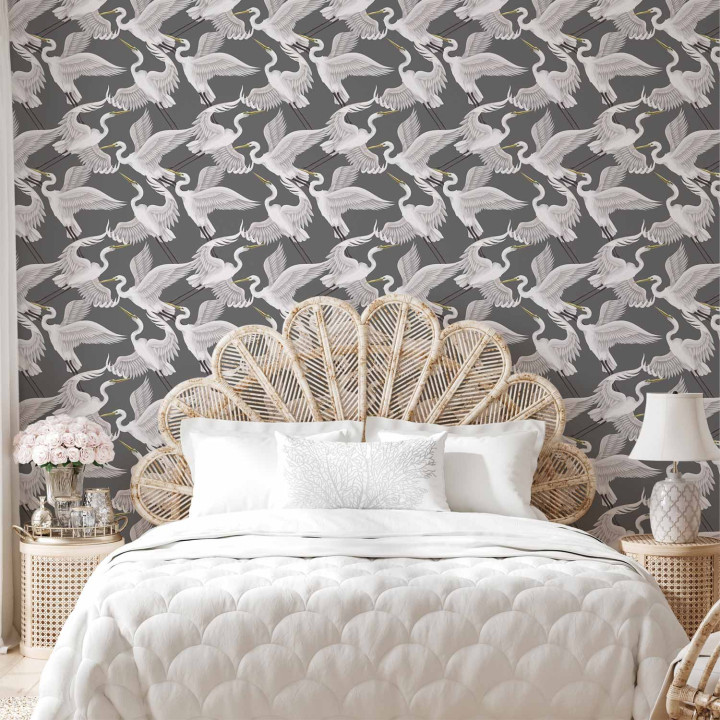 Behang - Flying birds – a delicate pattern of white and grey herons on a grey background