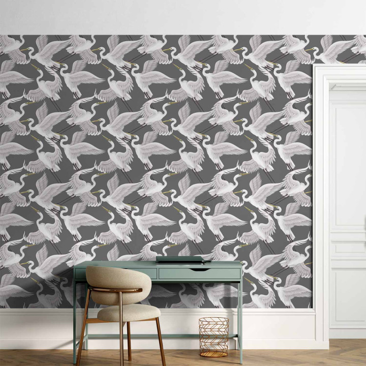 Behang - Flying birds – a delicate pattern of white and grey herons on a grey background